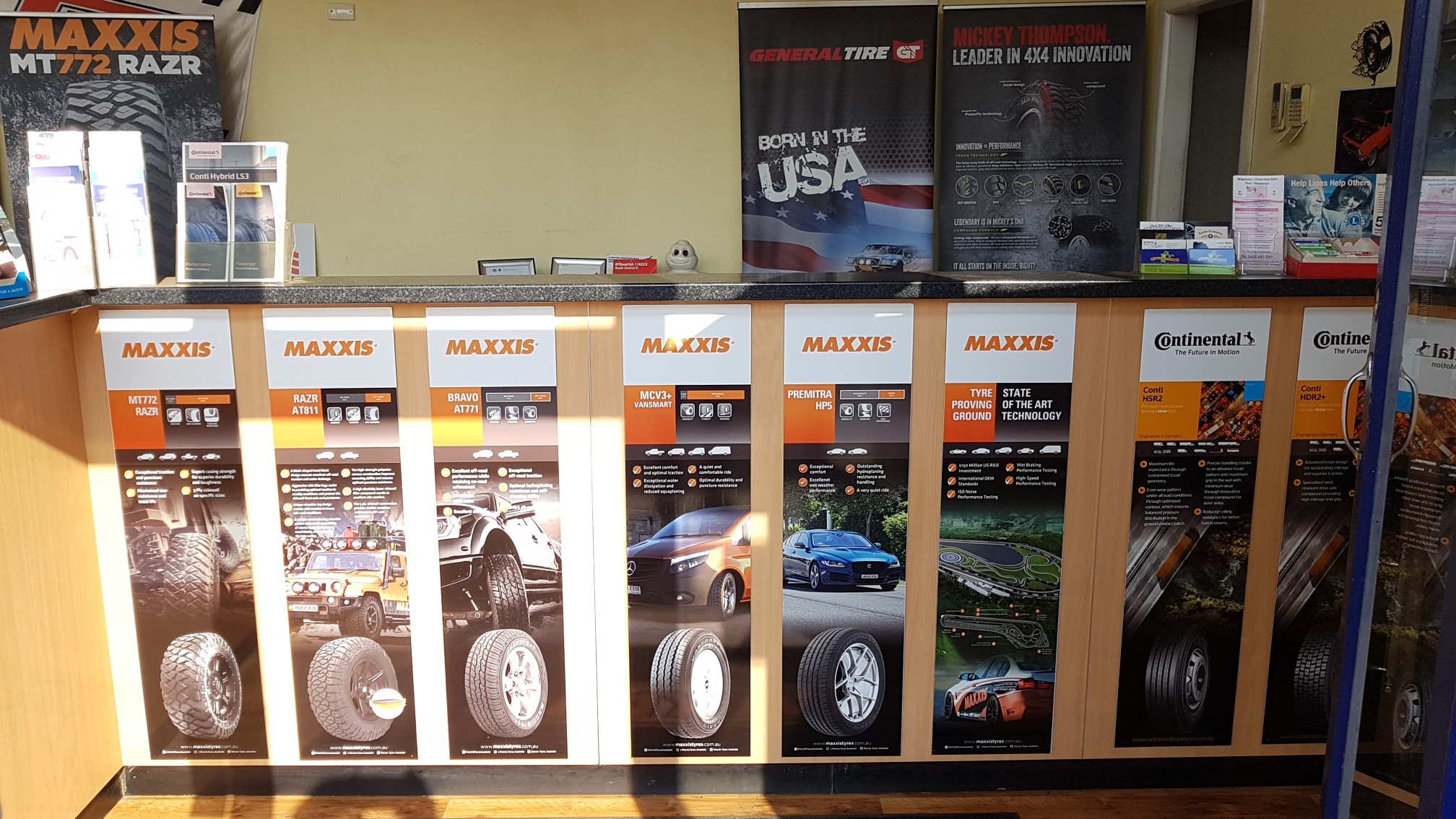 Tyre display boards inside the Cootamundra workshop showing the Maxxis and Continental ranges
